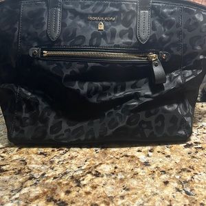 Black leopard print Michael Kors travel hand bag